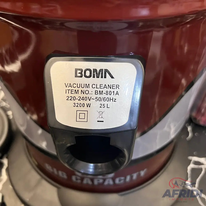 Red and silver vacuum cleaner with a label displaying the brand ’BOMN,’ model ’BM-801A,’ and specifications including 220-240V~50/60Hz, 3200W, and 25L capacity.