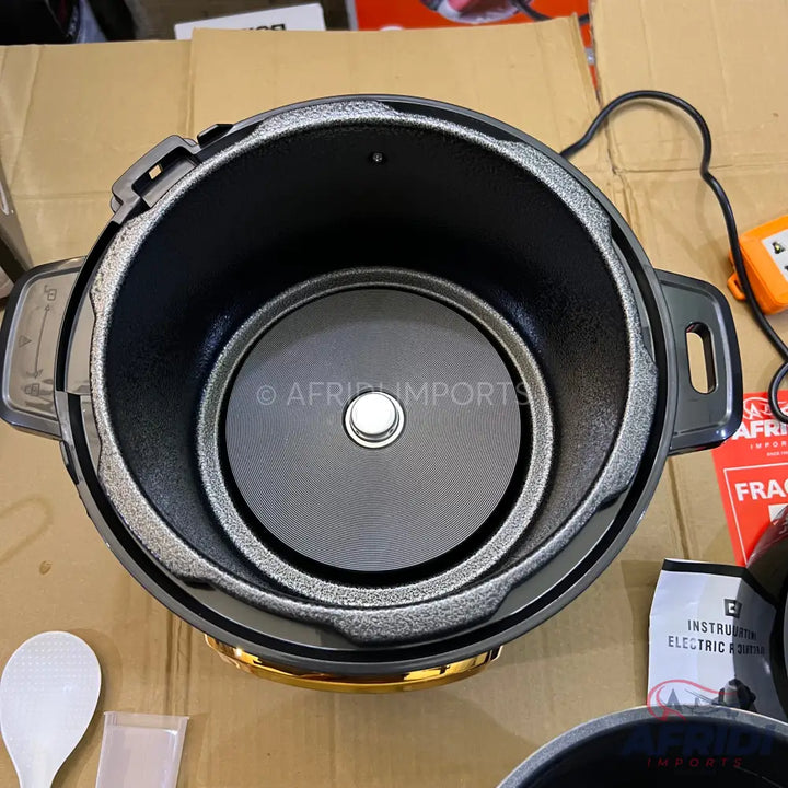 An open electric pressure cooker with a non-stick inner pot.
