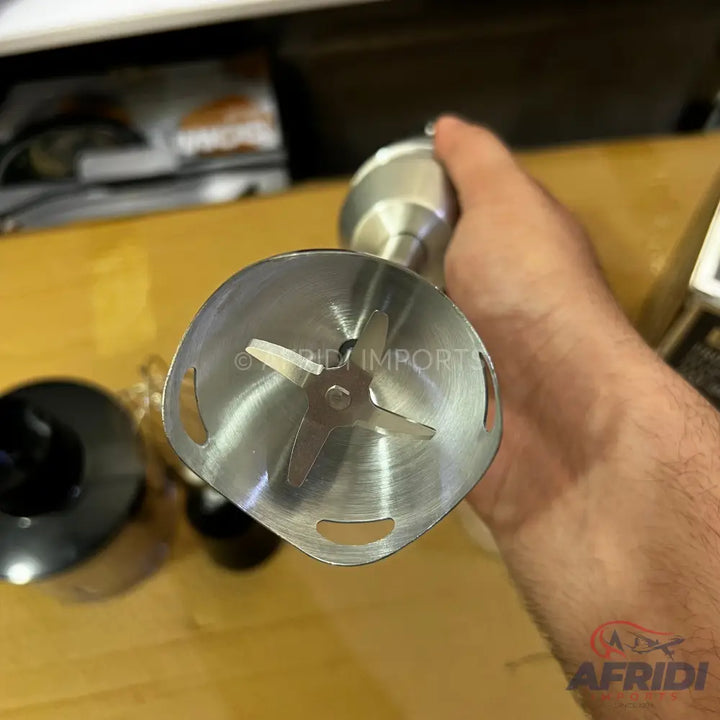 A silver immersion blender with a four-blade head.