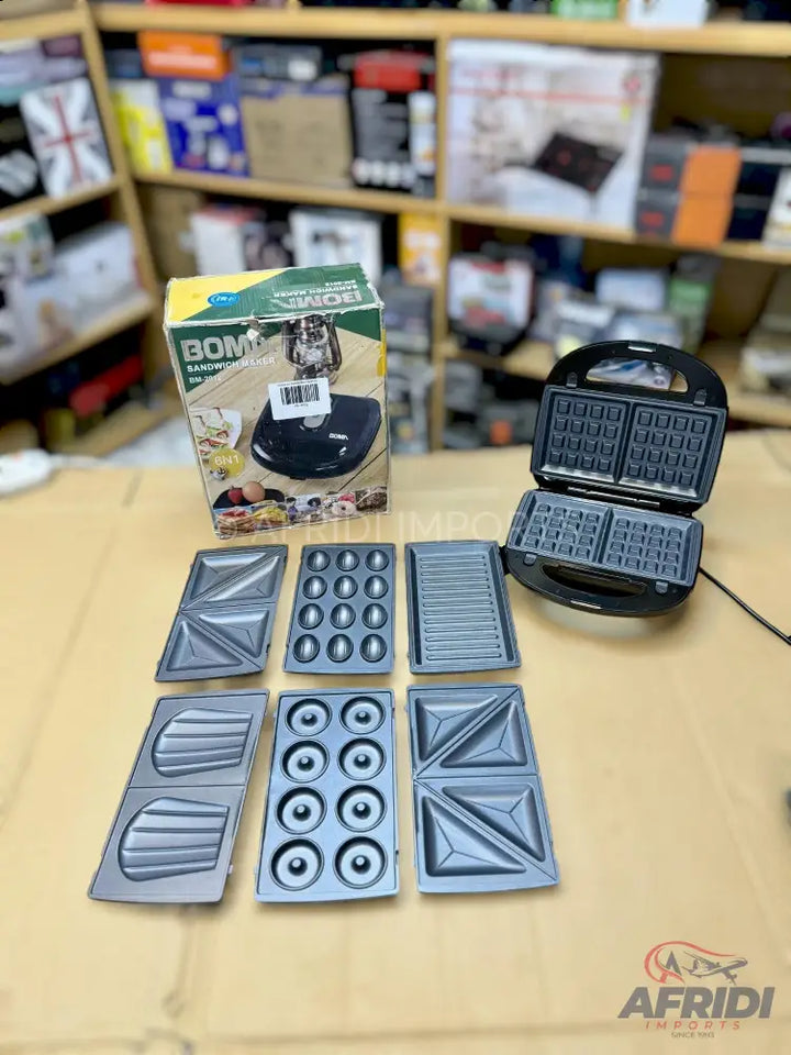 A multi-functional waffle maker with six interchangeable cooking plates for various snacks.