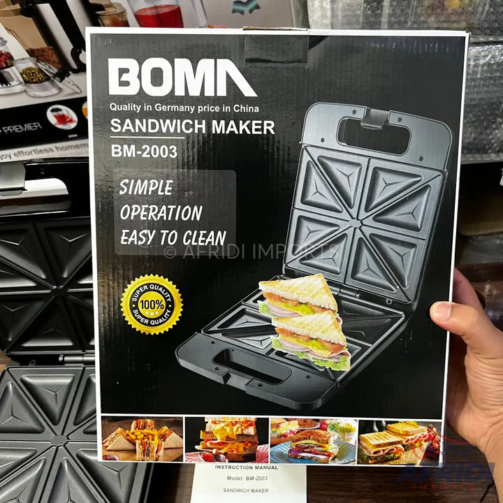 Black electric sandwich maker with square indentations, featuring a hinged design for cooking two sandwiches simultaneously.