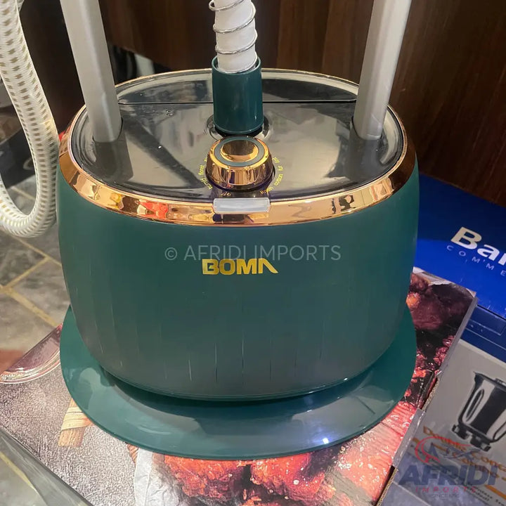Teal and gold garment steamer.
