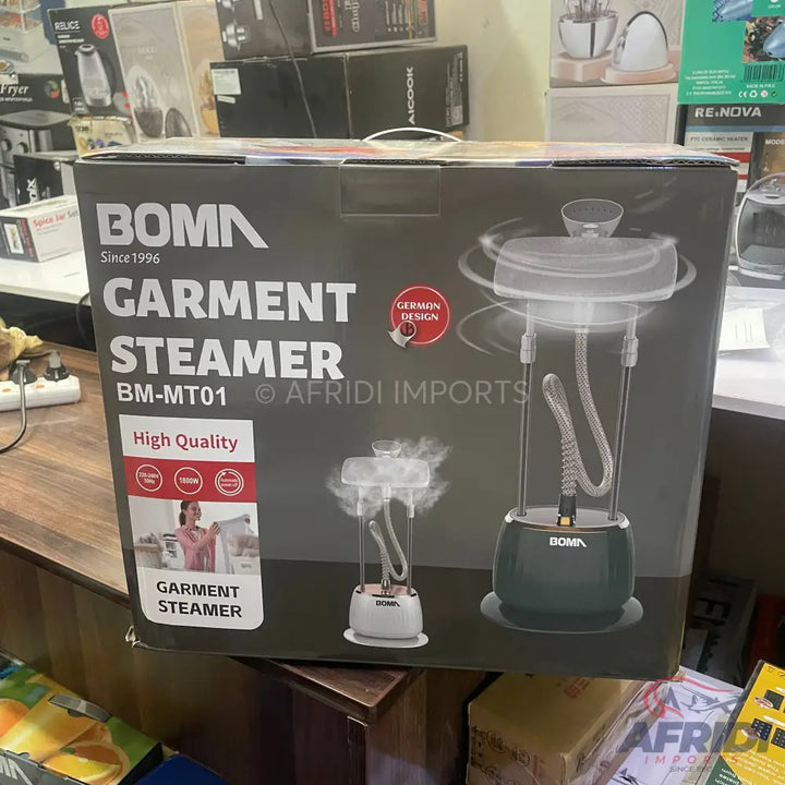 A boxed Boma garment steamer with a ’German Design’ label, model BM-MT01.