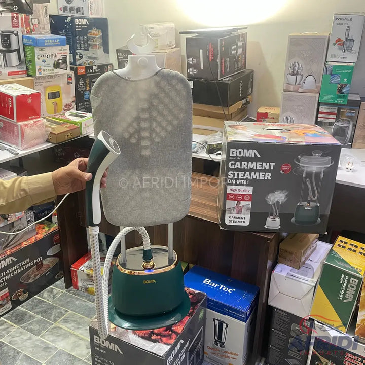 A dark green and white garment steamer with a mannequin-like stand.