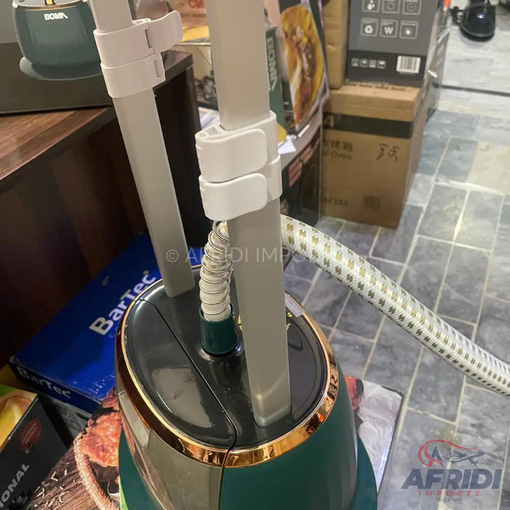 Teal and gold garment steamer with an extendable pole.