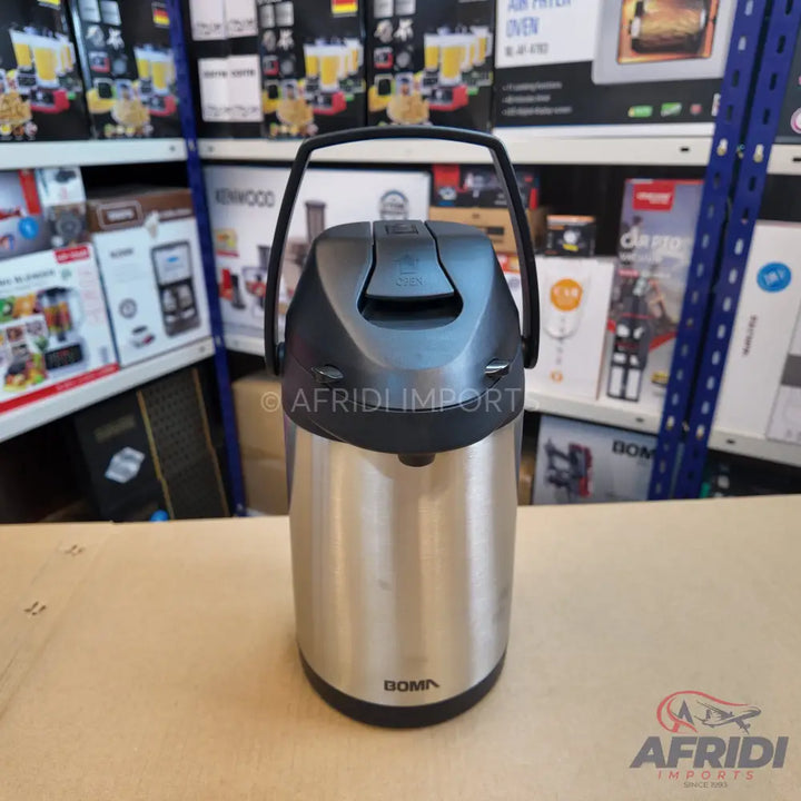 Stainless steel thermal airpot with a black handle and top.