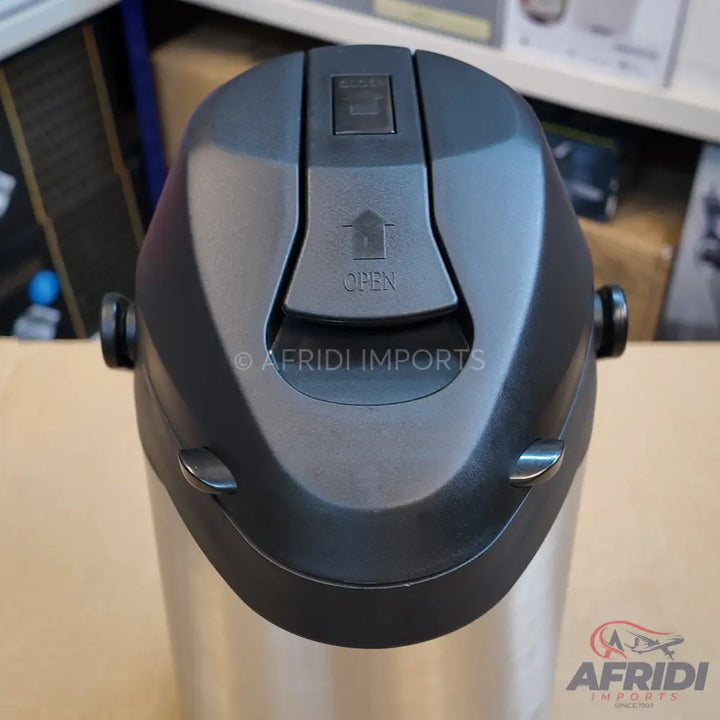 Stainless steel thermal airpot with a black pump-action lid.