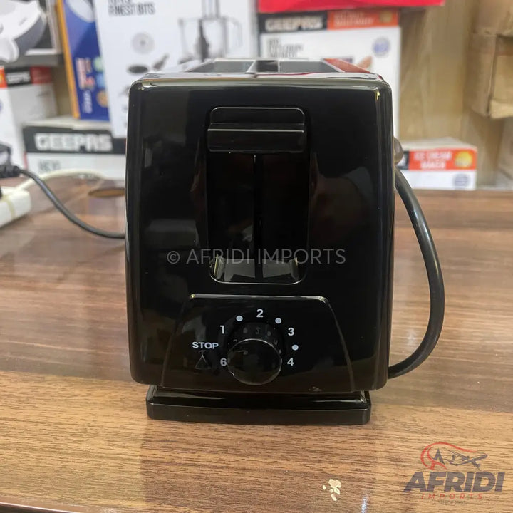 Black two-slice toaster with a browning control dial.
