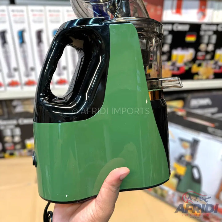 Green and black electric juicer with a handle.
