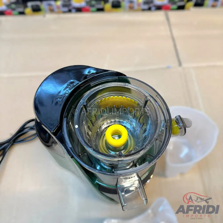 Black and transparent electric citrus juicer with a yellow reamer.