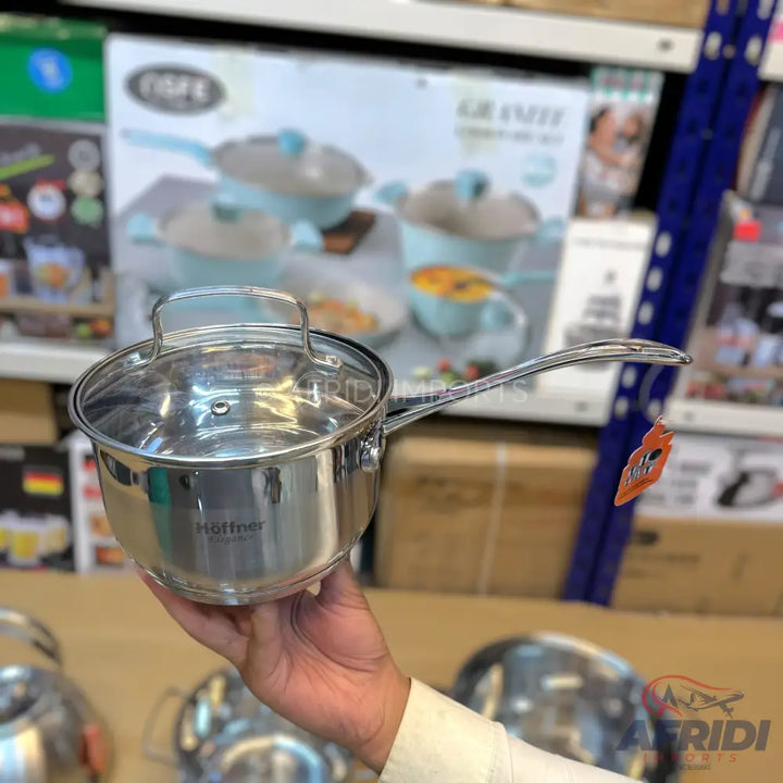 Stainless steel saucepan with a clear glass lid and a long handle.