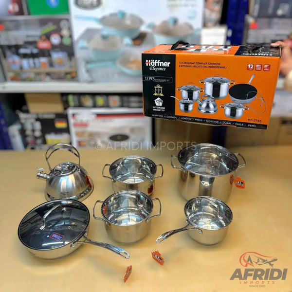 A 12-piece stainless steel cookware set including pots, pans, and a kettle.