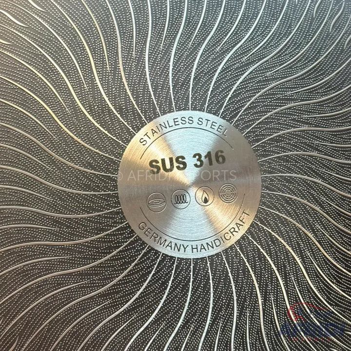 A stainless steel pan with a textured, non-stick surface.