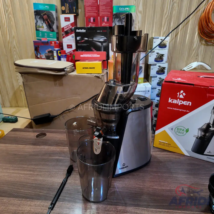 Silver and black slow masticating juicer with two clear collection cups.