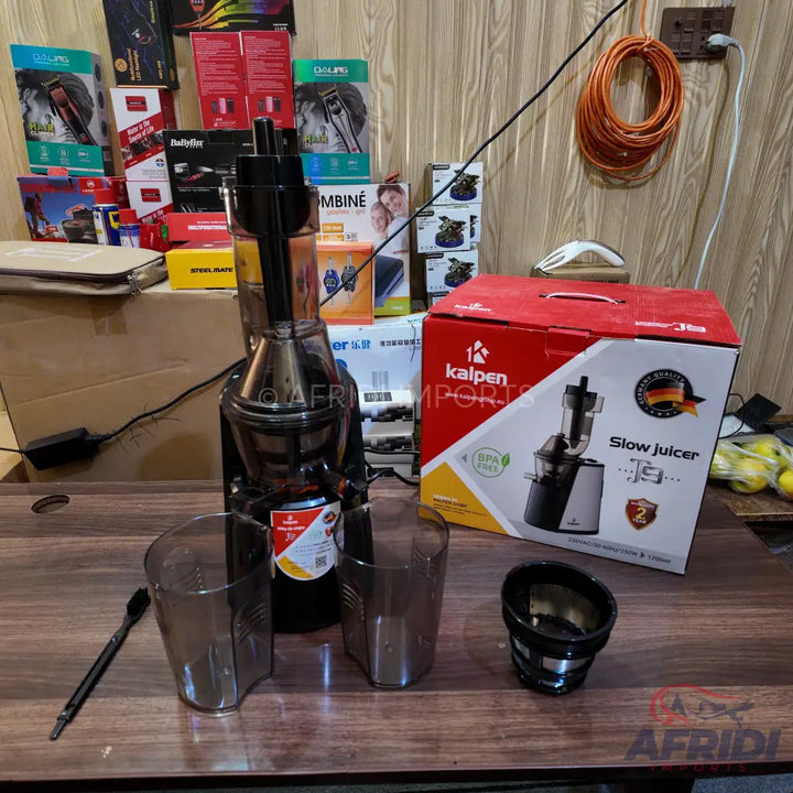 Black slow juicer with two clear collection cups and a filter basket.