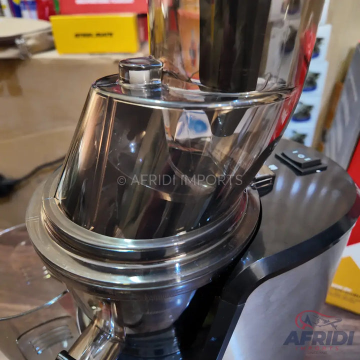 A coffee grinder with a clear hopper and stainless steel components.