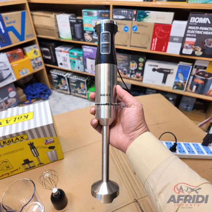 Stainless steel immersion blender with a black handle and two control buttons.