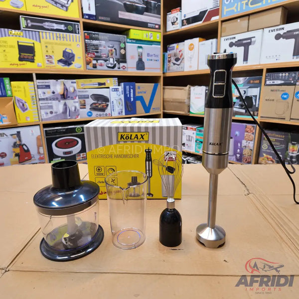 A stainless steel and black immersion blender with multiple attachments including a whisk, a chopper, and a measuring cup.