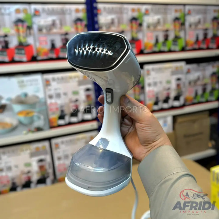 Handheld white and gray garment steamer with a clear water tank.