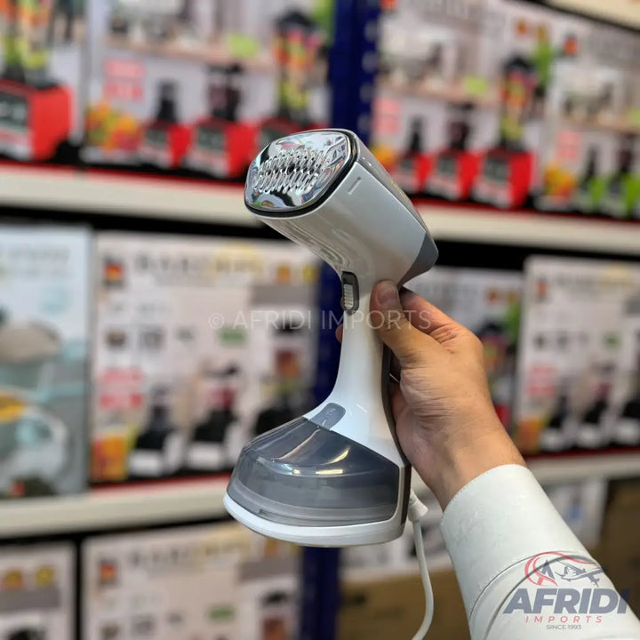 Handheld garment steamer with a white body and a translucent gray water tank.