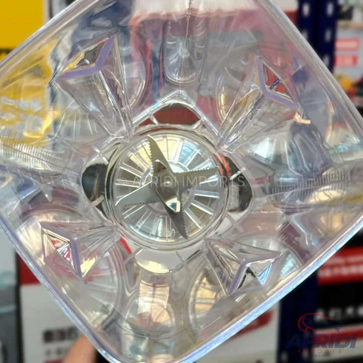 Clear plastic blender cup with a four-blade assembly.