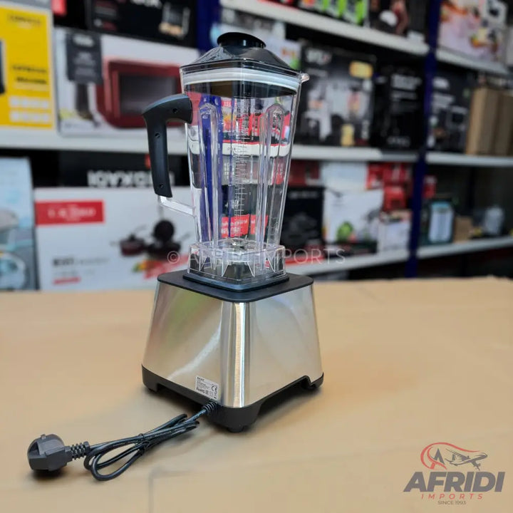 A stainless steel blender with a clear plastic pitcher and a black power cord.