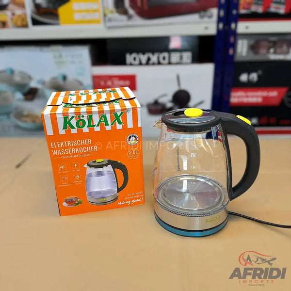 A clear glass electric kettle with a black handle and yellow accents.