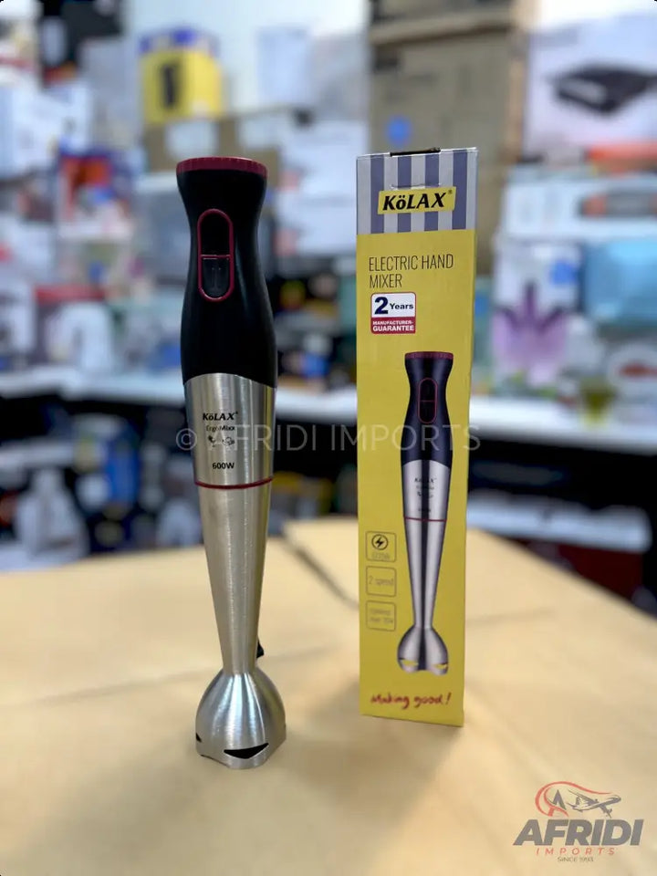 A black and silver electric hand mixer with a matching box.