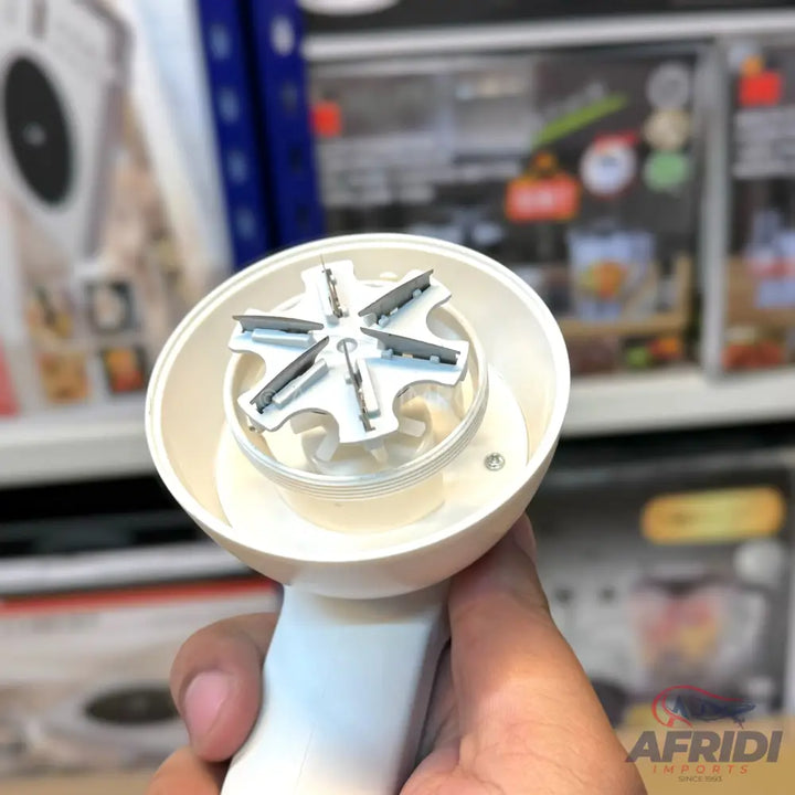 Handheld white food chopper with six blades.