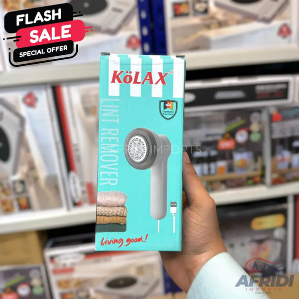 Light blue box for a lint remover with a graphic of the device and folded fabric.