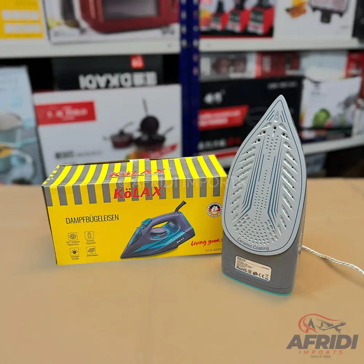 A steam iron with a grey and teal body, a textured soleplate, and a yellow box with a depiction of the iron.