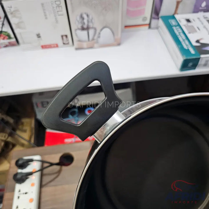 Black non-stick frying pan with a black handle.