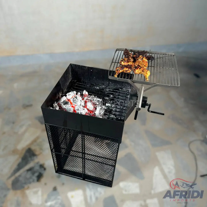 Black rectangular charcoal grill with a side-mounted rotating grate for cooking.