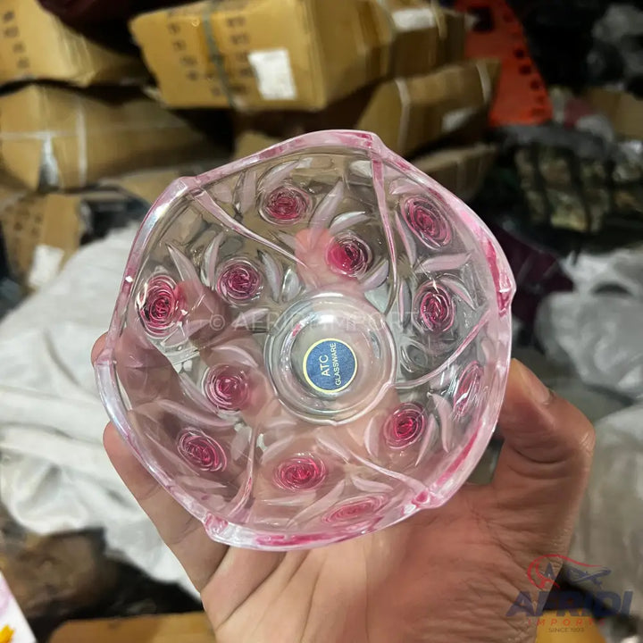 Pink glass bowl with a rose design.