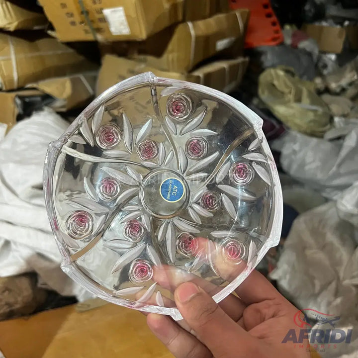 Clear glass serving dish with a floral pattern and pink accents.