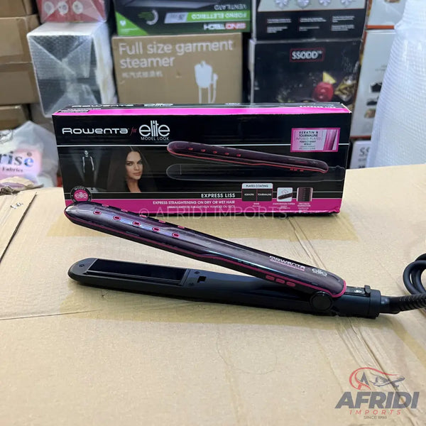 A black and pink hair straightener with its product box.