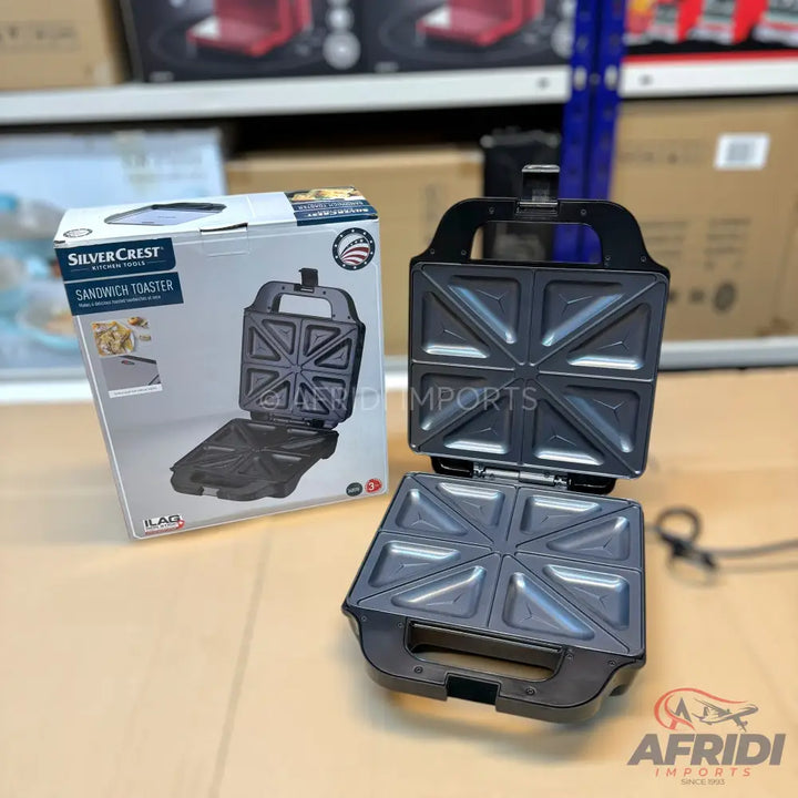 Black SilverCrest sandwich toaster with triangular compartments.