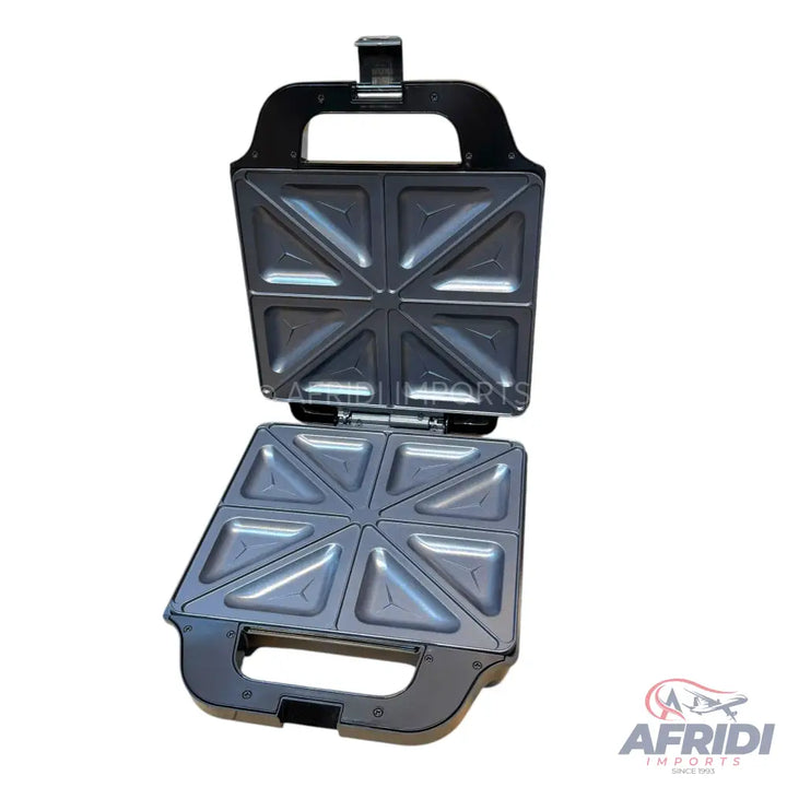 An open black electric sandwich maker with non-stick triangular cooking plates for four sandwiches.