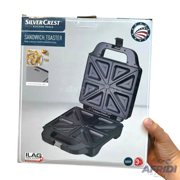 A SilverCrest Kitchen Tools sandwich toaster with non-stick plates, an indicator light, and 1400W power.