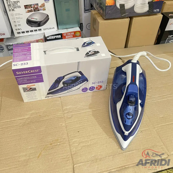 A blue and white electric steam iron with its product box.
