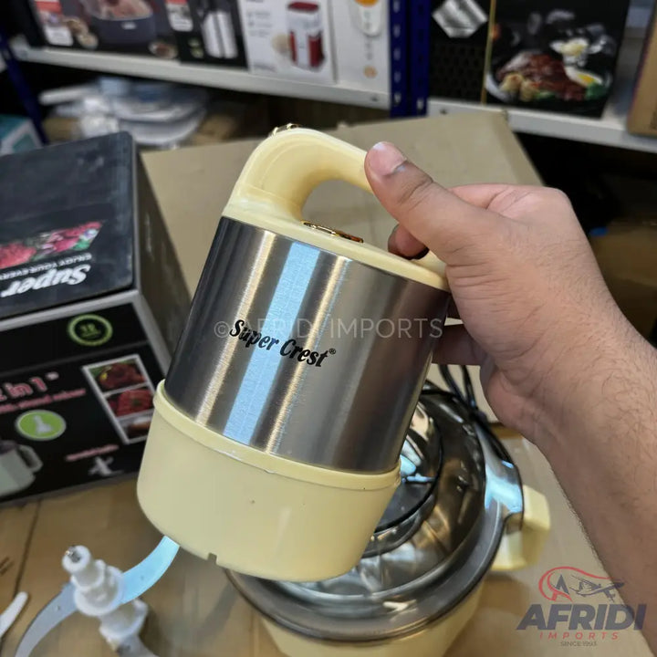 A beige and silver food processor motor unit with a handle, designed to attach to a bowl with blades.