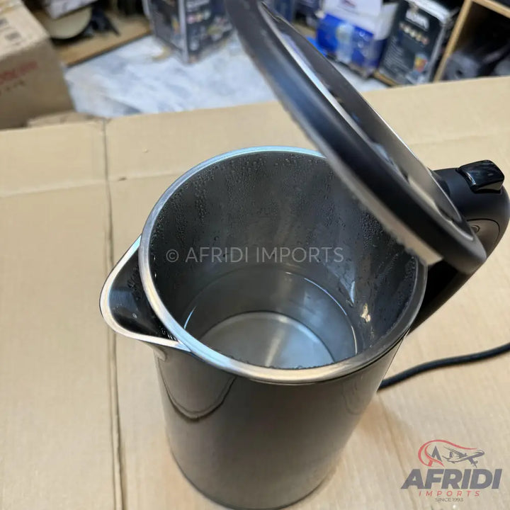 Black electric kettle with a stainless steel interior and an open lid.