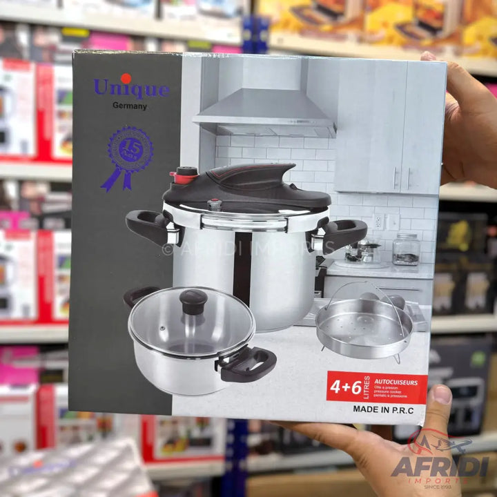 A stainless steel pressure cooker set with a smaller pot and steamer insert.
