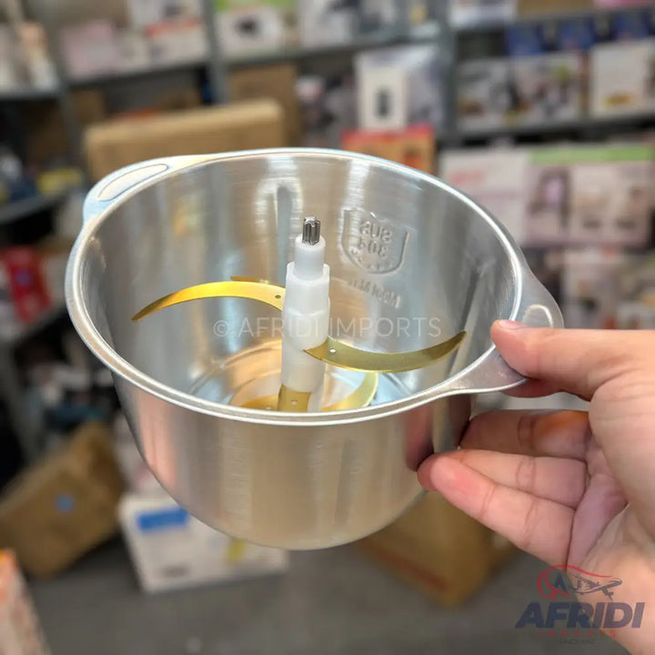 Stainless steel food processor bowl with a two-blade chopping attachment.