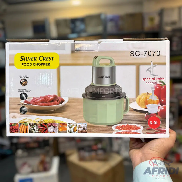 Silver Crest food chopper with a 6.0L capacity, featuring a powerful electric motor and high-quality stainless steel blades, suitable for processing various foods.