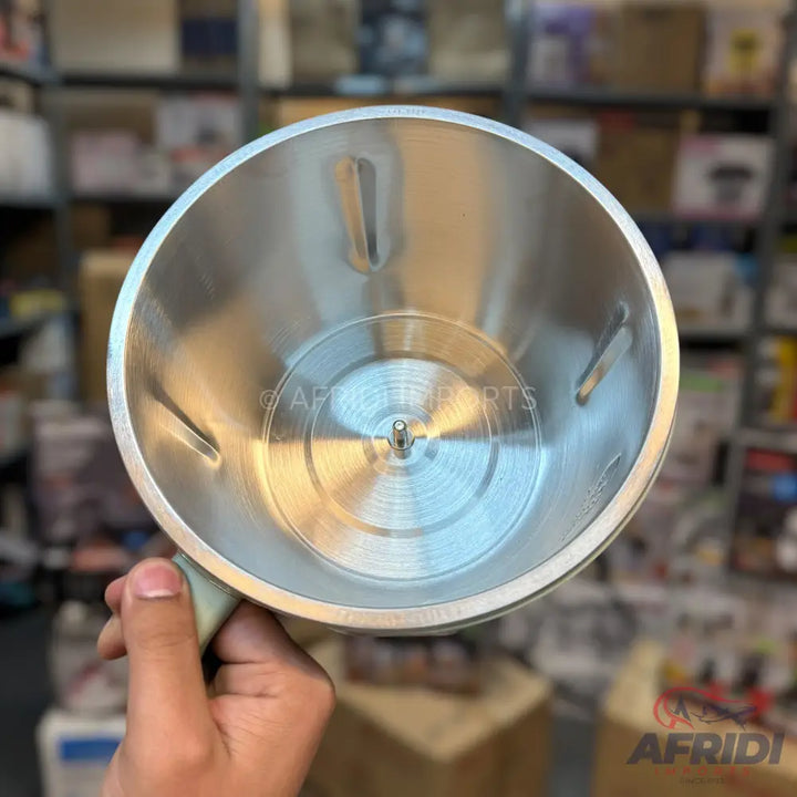 Stainless steel blender jar with a central spindle and internal fins.