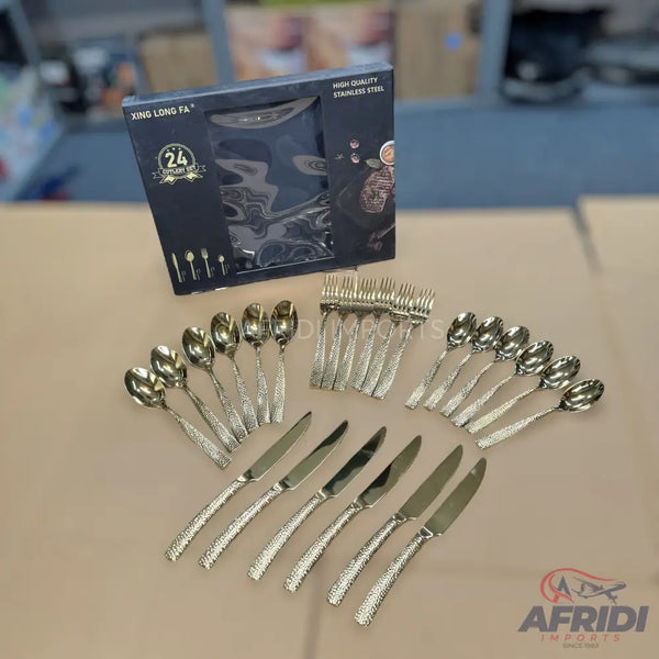 A 24-piece stainless steel cutlery set with textured handles, including spoons, forks, and knives.