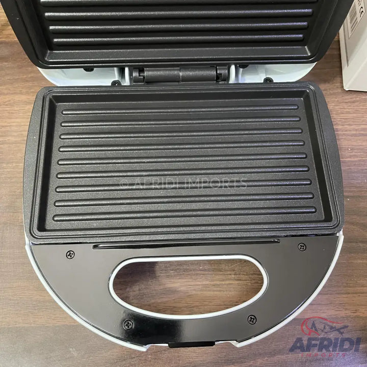 Open electric grill or sandwich maker with ribbed, non-stick cooking plates.