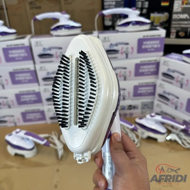 Handheld garment steamer with a brush attachment.