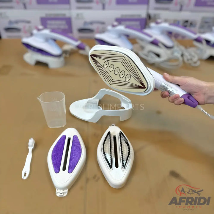 A portable handheld garment steamer with interchangeable attachments and accessories.